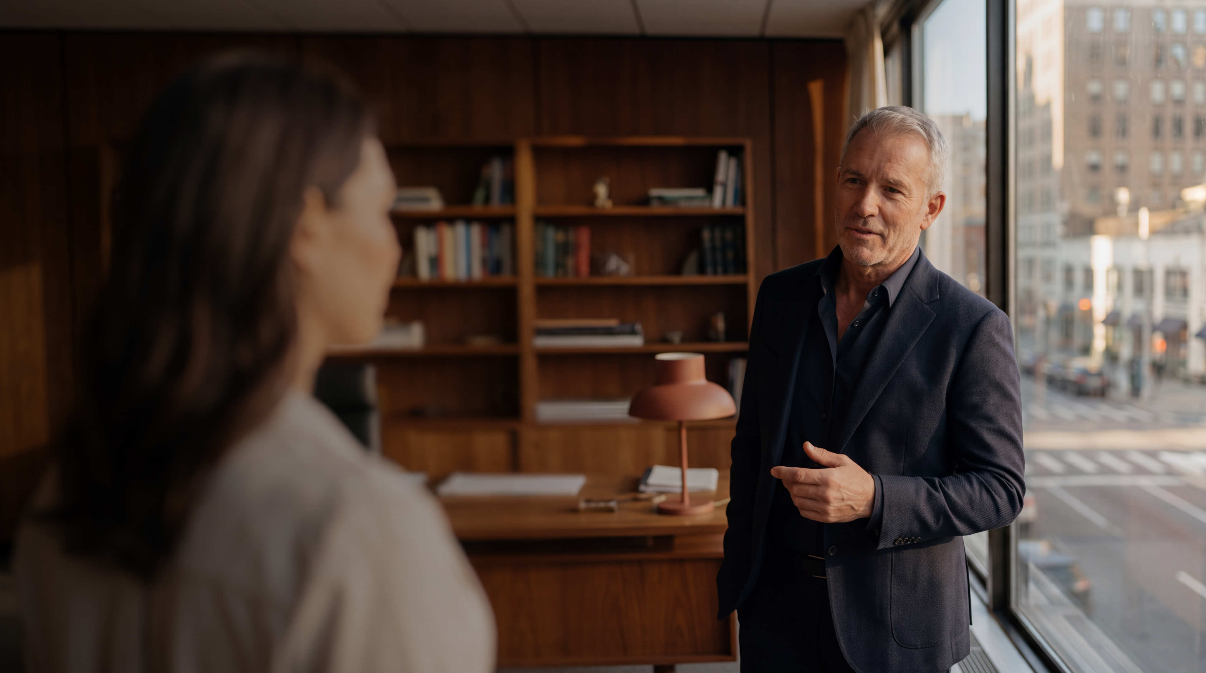 Adam Hall CPA speaking with a colleague in a sunlit office